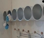 利用废旧奶粉罐制作挂墙收纳架