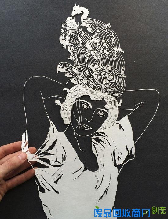 剪纸艺术家白纸上的奇思妙想