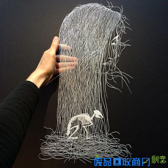 剪纸艺术家白纸上的奇思妙想