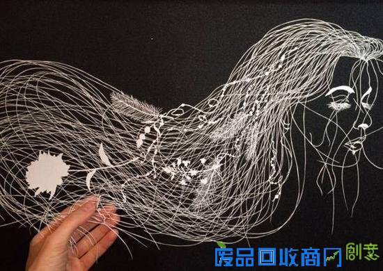 剪纸艺术家白纸上的奇思妙想