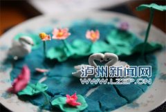 只因儿子太内向 母爱让泸州摄影师变身“泥人张”