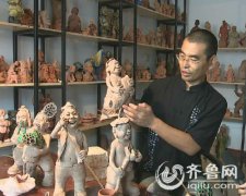 泥塑荷娃喜迎第十一届中国（滕州）微山湖湿地红荷节