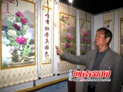 洛阳65岁工程师研制出牡丹画电暖器 能挂墙卷起